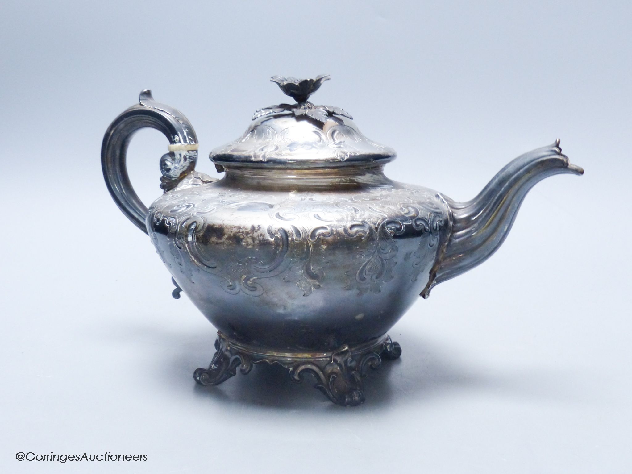 A late William IV embossed silver squat melon shaped teapot, by The Barnards, London, 1837, gross weight 24oz.